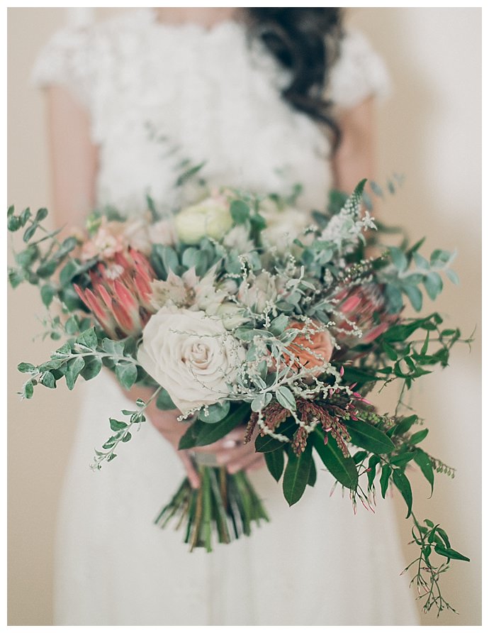 bridal bouquet with roses and protea