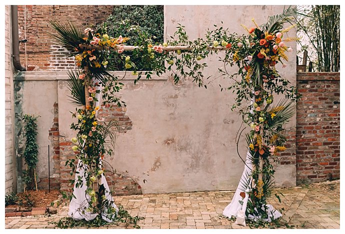 floral-covered-weddig-altar-dark-roux-photography