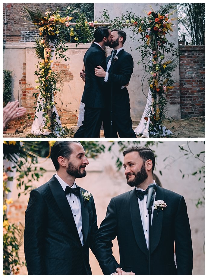 flower-covered-wedding-arch-dark-roux-photography