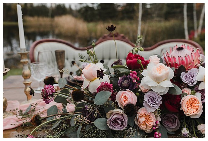 protea and garden rose flower arrangement