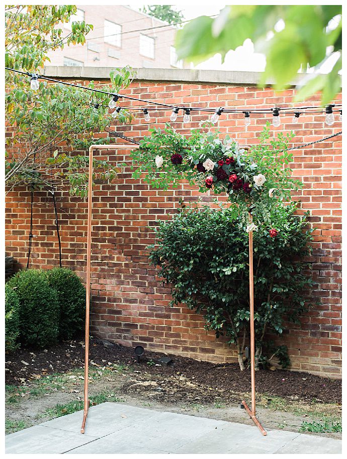 lissa-ryan-photography-copper-ceremony-arch-with-flowers