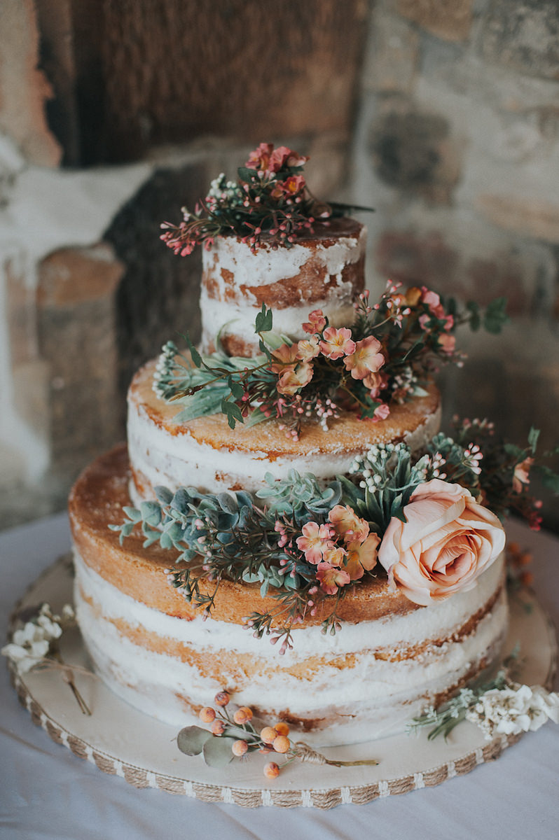 semi-naked-wedding-cake-with-fresh-flowers