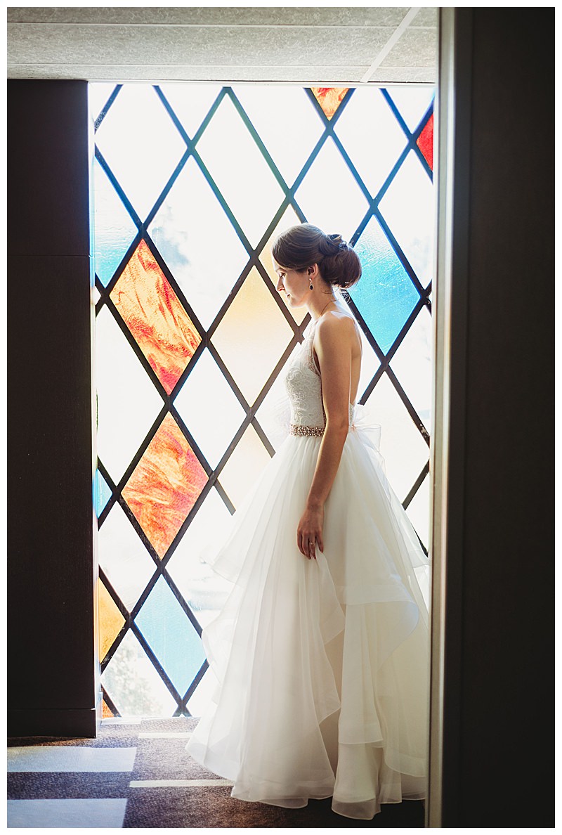 bride-in-front-of-stainglass-window