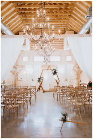 geometric ceremony backdrop in barn