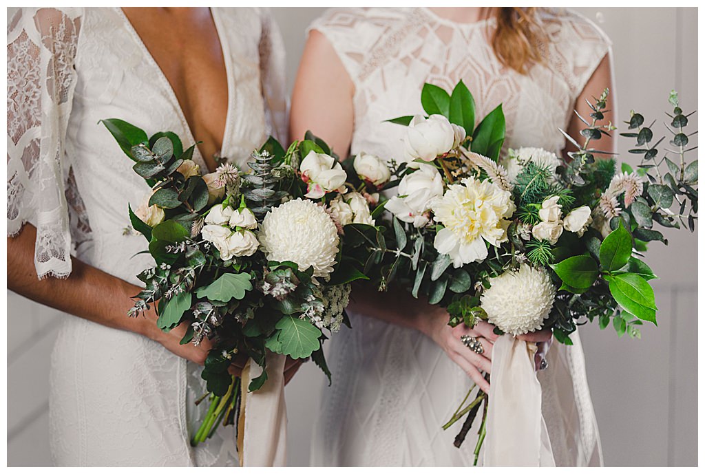 two-bridal-bouquets-with-greenery-and-white-flowers