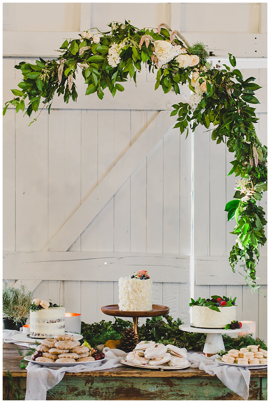 wedding-cake-display-with-greenery