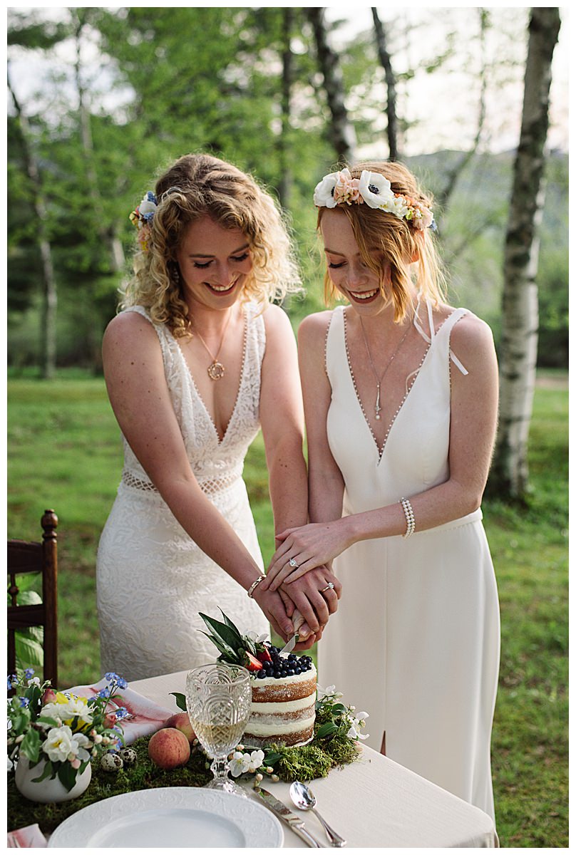 two-brides-cutting-cake