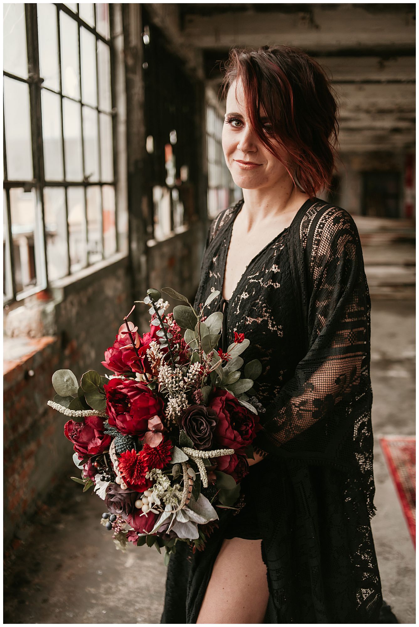 black-wedding-dress-with-red-bouquet