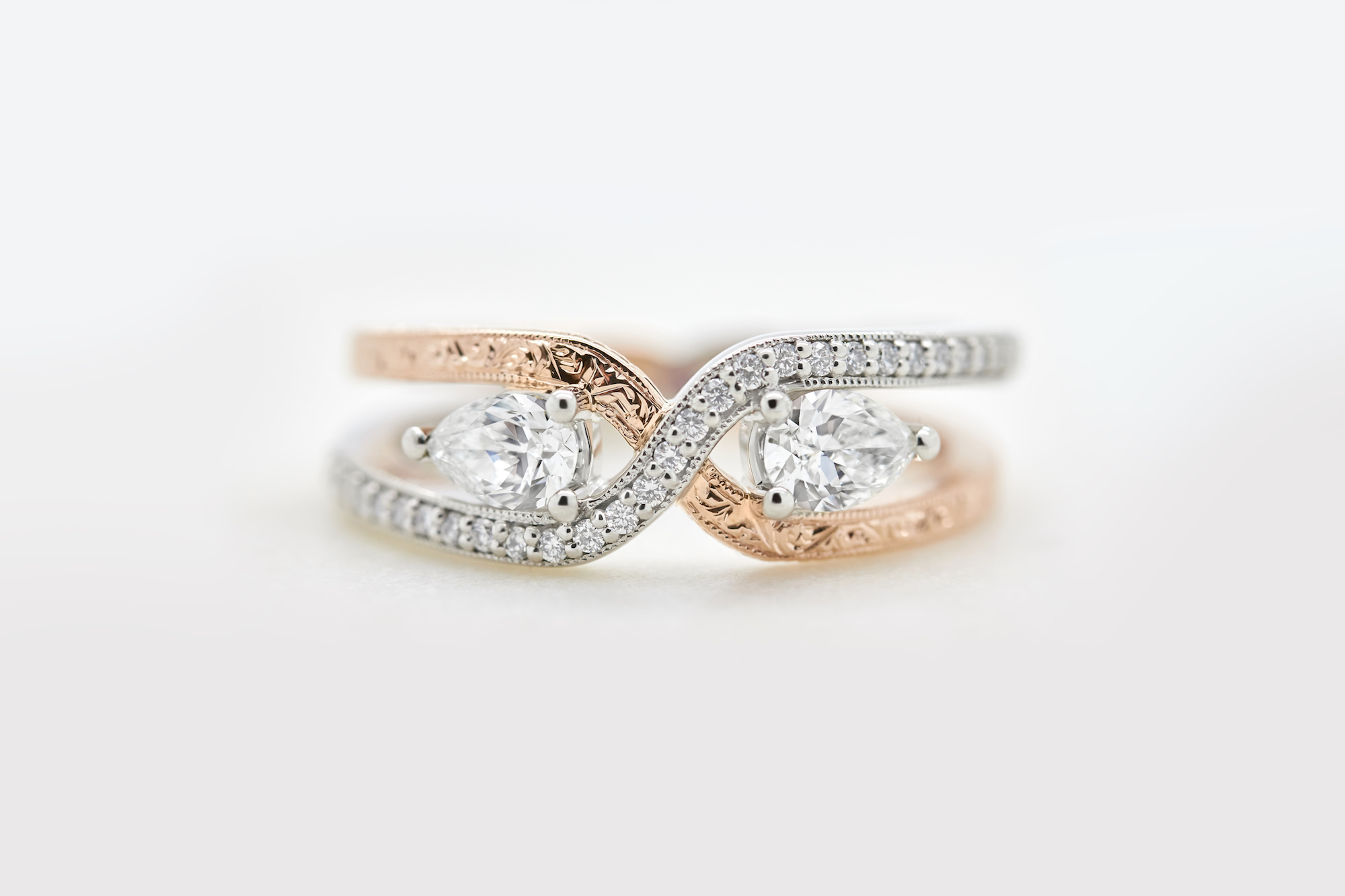 double band engagement ring with two pear diamonds