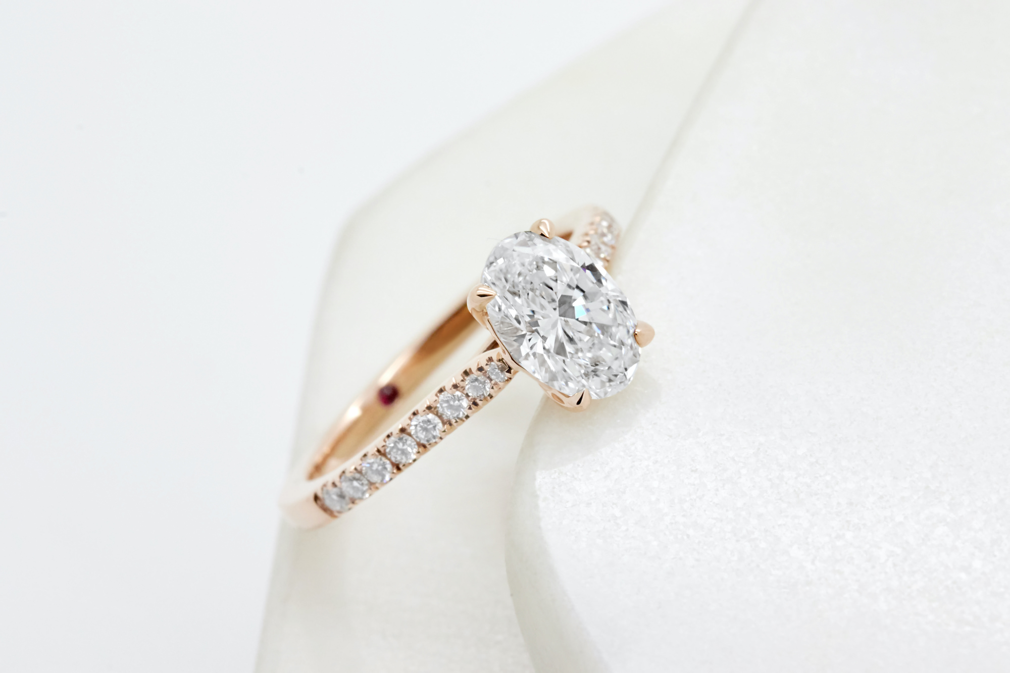 oval diamond pave engagement ring in rose gold