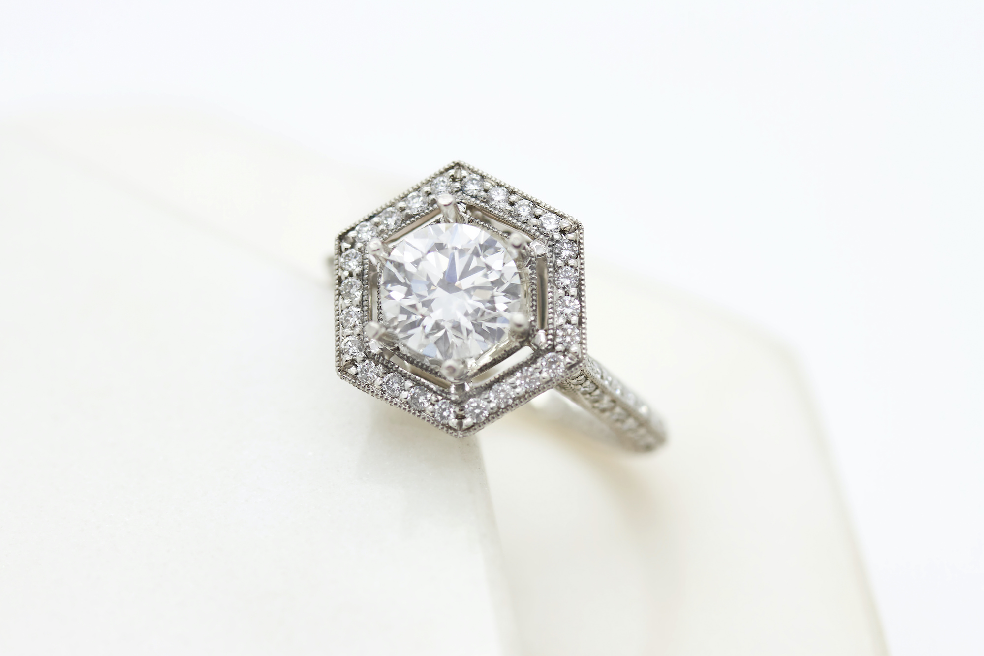 round diamond and hex halo vintage engagement ring