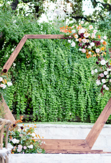 Wooden Geometric Wedding Ceremony Backdrop with Flowers