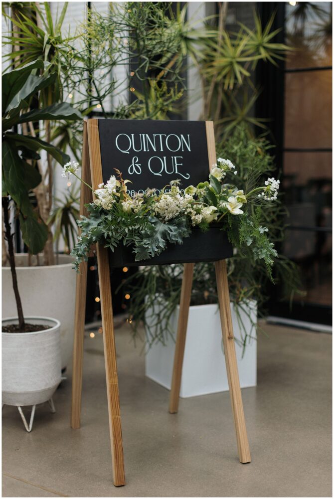 Wedding sign with floral decoration and plants