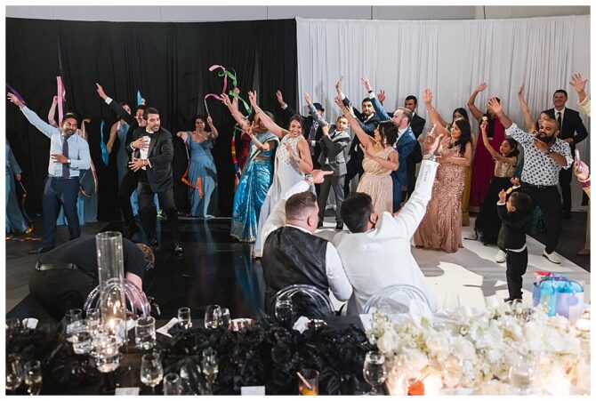 Group dancing at vibrant wedding celebration