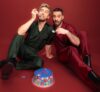 Two men eating cake celebrating 10 years anniversary.