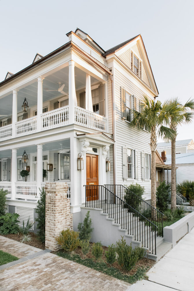 Historic Southern home with porch and palm trees