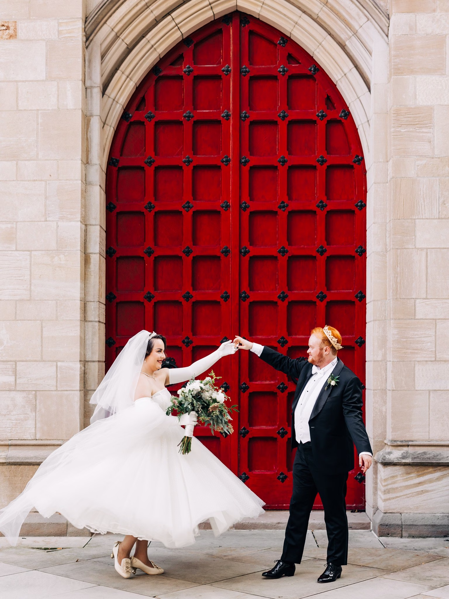 bride groom dancing red church doors wedding photography